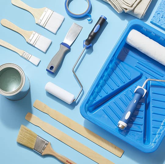 A selection of KMEID Trading paint brushes, rollers, and tools